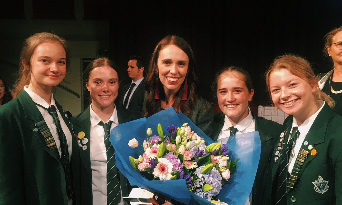 Jacinda with flowers and snr students-4web.jpg